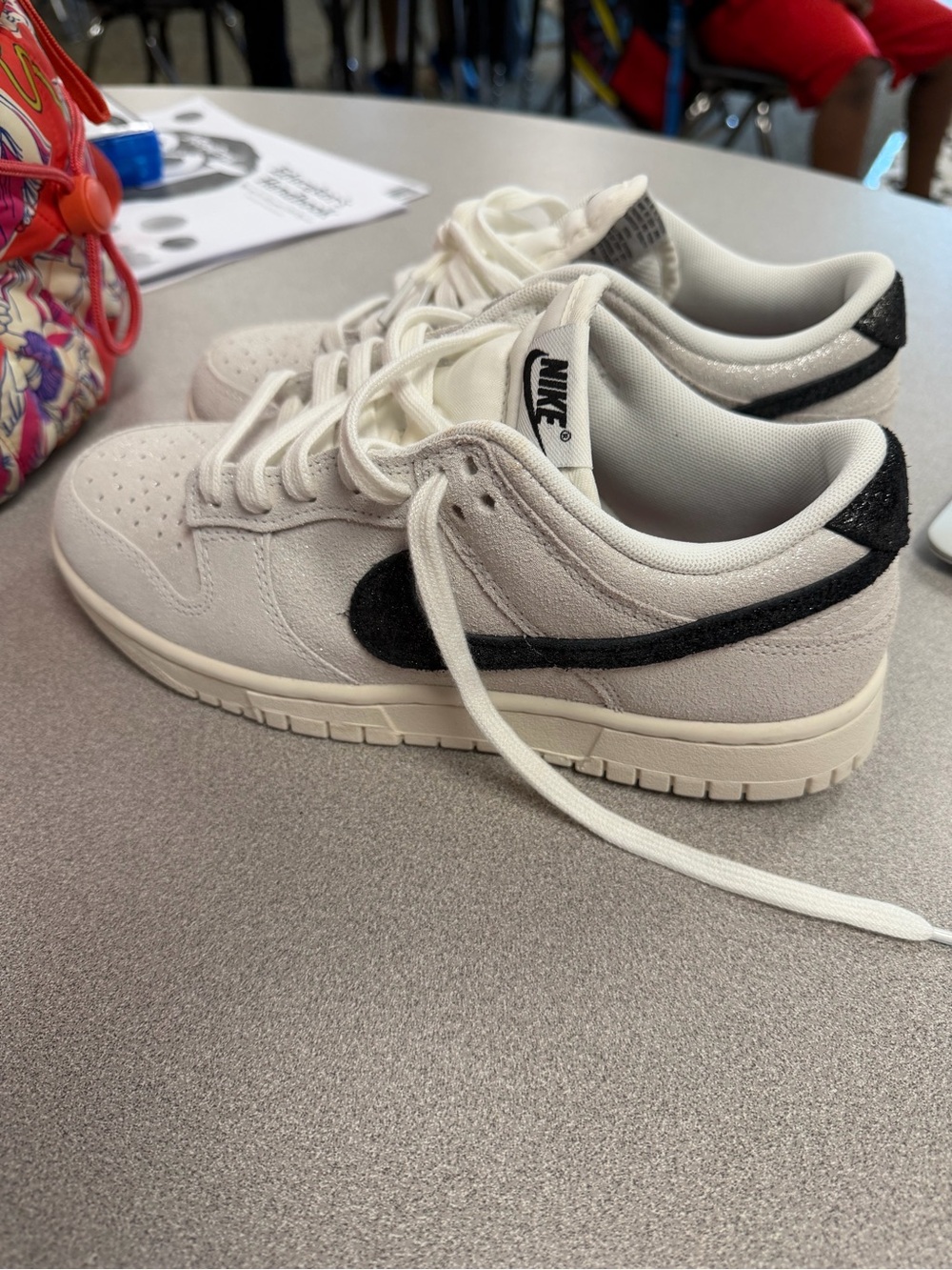 Nike Women’s Low-Top Suede Sneakers in Off-White with Black Swoosh